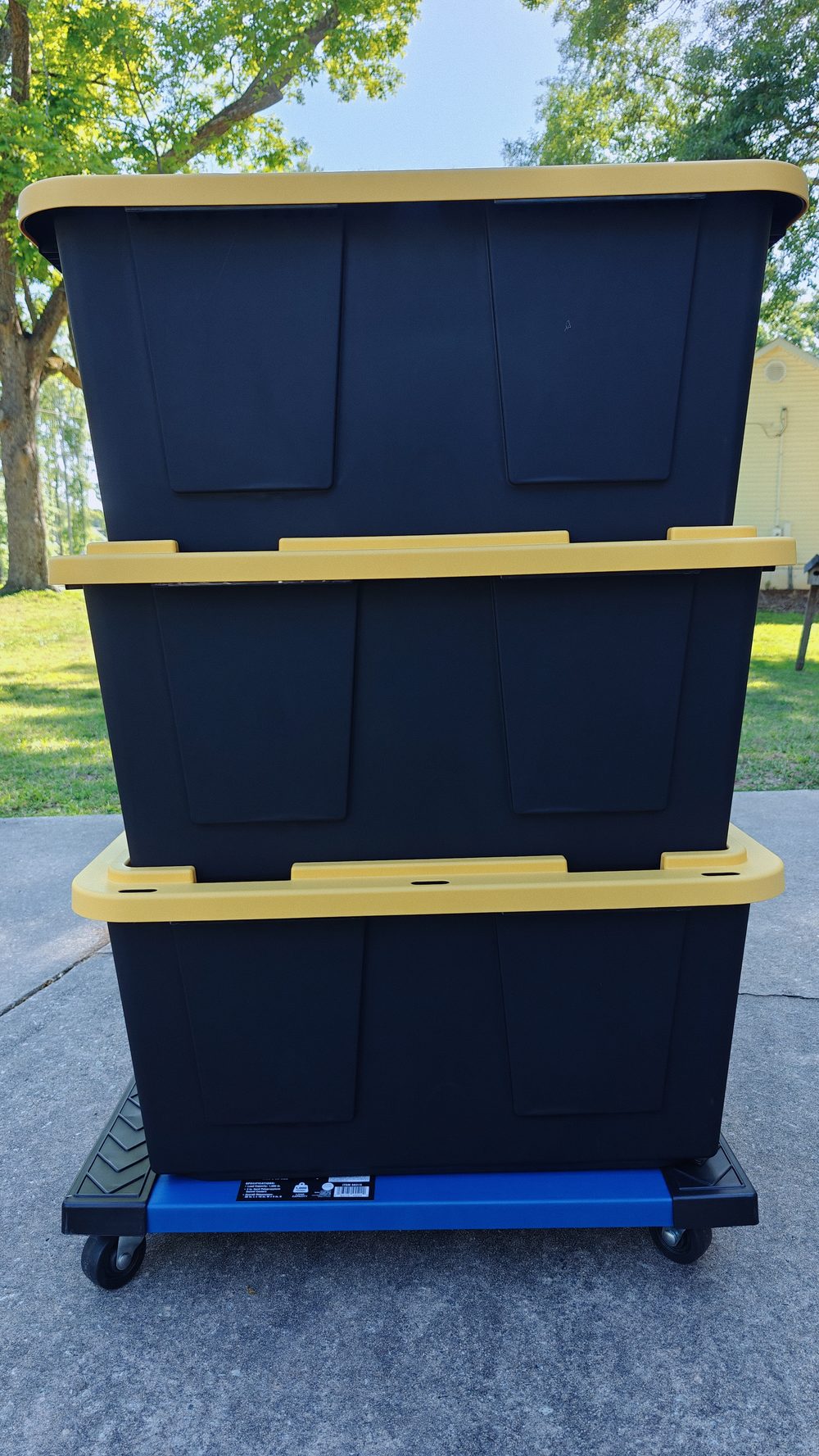 Stacked Seacoast totes loaded on a moving dolly